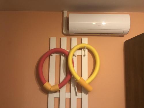 two olympic rings are hanging on a wall at Respect Apartament in Hévíz