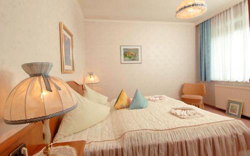 a bedroom with a large bed with pillows on it at Appartement Eva in Sankt Kanzian