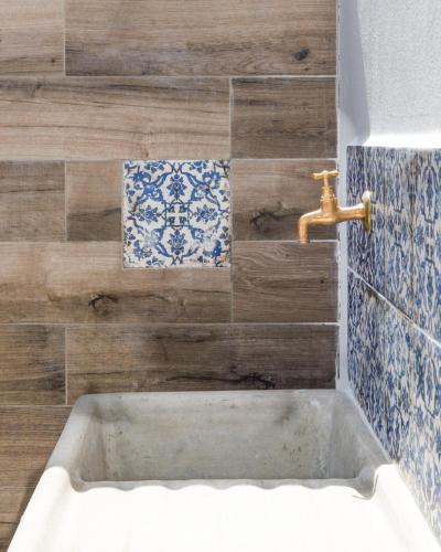 a bathroom with a sink and a tap at Villa Cinzia-150 mt from the beach in Mondello