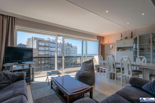 a living room with a view of a city at Zeerust 0302 in Koksijde