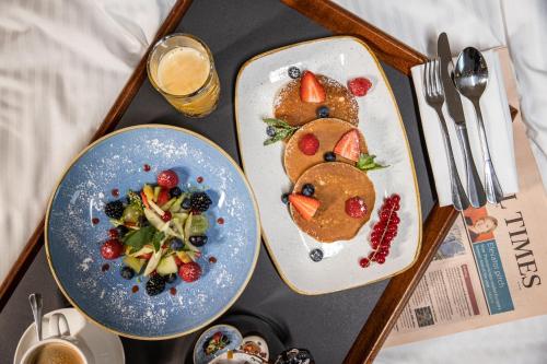 a tray with two plates of food in the shape of a teddy bear at Crowne Plaza Brussels Airport by IHG in Zaventem