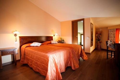 Postelja oz. postelje v sobi nastanitve Hotel Ristorante Al Duca