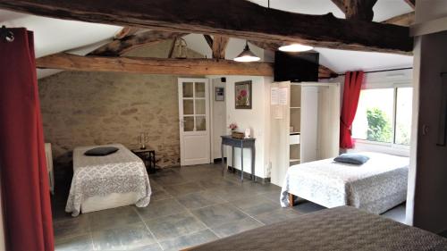 Cama o camas de una habitación en Au Petit Bignon