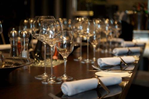 a long table with wine glasses and napkins at The Blue Bell Inn in Weaverthorpe