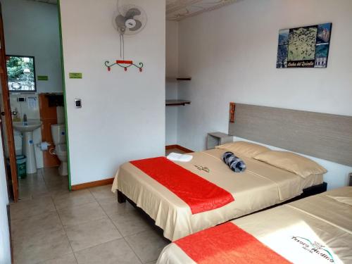 Un pat sau paturi într-o cameră la Tesoro Andino