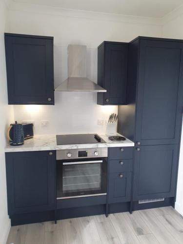 
A kitchen or kitchenette at Central Portree Apartment
