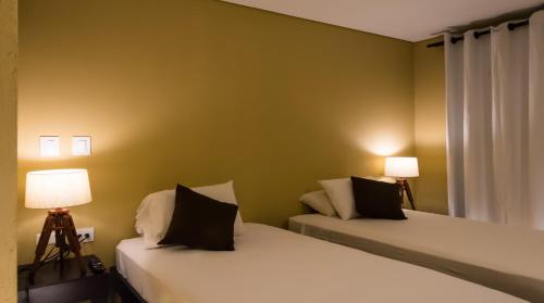 Una cama o camas en una habitación de Oasis Fresh Hotel