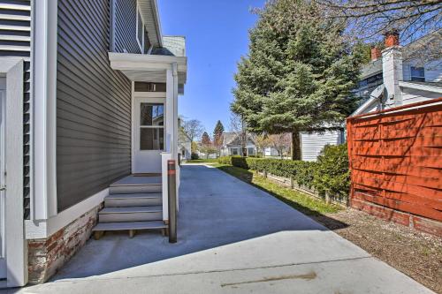 a house with stairs leading to the front door at Cozy and Urban Ludington Apt about 1 Mi to Lake Michigan in Ludington