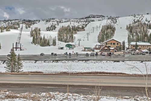 a ski resort with a ski lift in the snow at Luxe Brian Head Escape with Hot Tub and Mtn Views in Brian Head