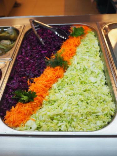 a tray of rice and carrots and other vegetables at Hotel Carmen Azzuro in Venus