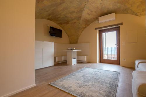 a living room with a couch and a tv at Montepagano 1137 in Montepagano
