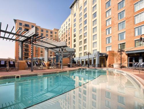 a large swimming pool in front of a building at Club Wyndham National Harbor in National Harbor