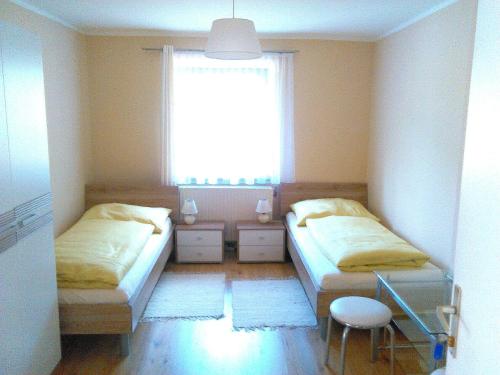 Ένα ή περισσότερα κρεβάτια σε δωμάτιο στο Seeblick Krippenstein