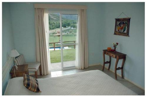 Ένα ή περισσότερα κρεβάτια σε δωμάτιο στο Hotel Posada Terrazas con pileta climatizada