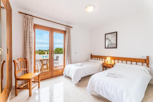 Postel nebo postele na pokoji v ubytování Apartamentos Karin 2ºD