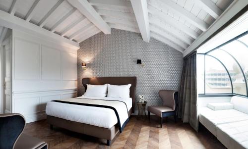Кровать или кровати в номере Hotel The Corner Roma