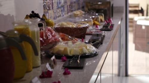 a buffet line with many different types of food at Pousada Receptur in Piranhas