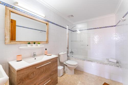 a bathroom with a sink and a toilet and a shower at Apartamentos Karin 1ºB in Felanitx