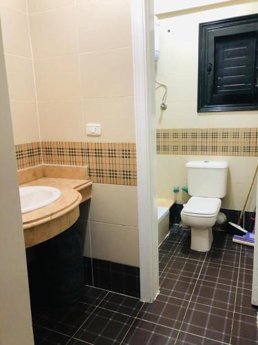 a bathroom with a sink and a toilet and a tub at فيلا الساحل الشمالى Villa North coast Marseilia Beach 3 " Families Only" in Alexandria