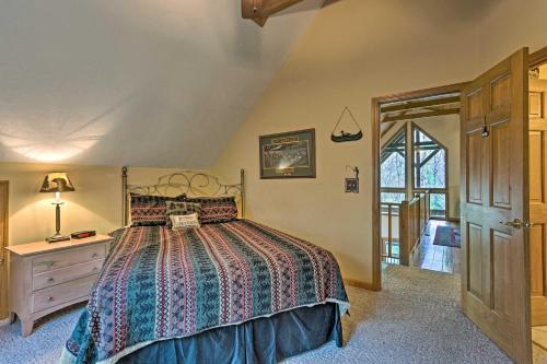 A bed or beds in a room at Spacious Maggie Valley Cabin with Hot Tub and MTN View