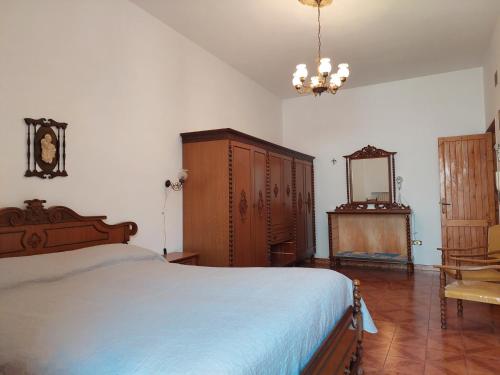 a bedroom with a bed and a dresser and a mirror at Only Bed in Polignano a Mare