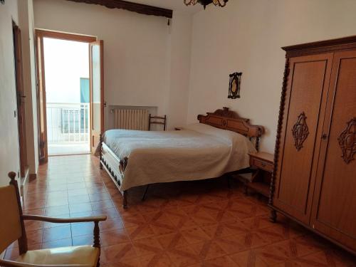 a bedroom with a bed and a large window at Only Bed in Polignano a Mare