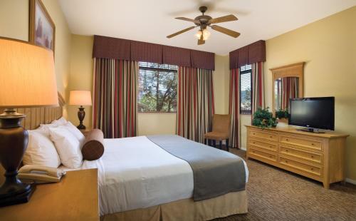 a hotel room with a bed and a flat screen tv at Club Wyndham Sedona in Sedona