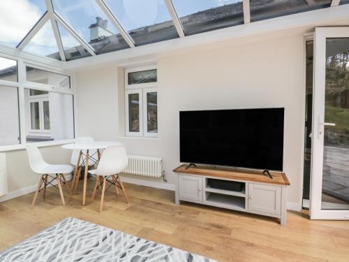 a living room with a flat screen tv at Green Acre in Ulverston