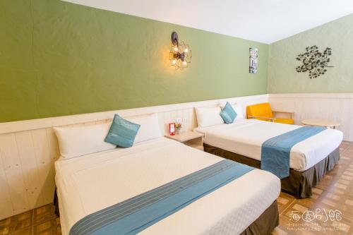 Postel nebo postele na pokoji v ubytování Hai Yuan Bungalow II