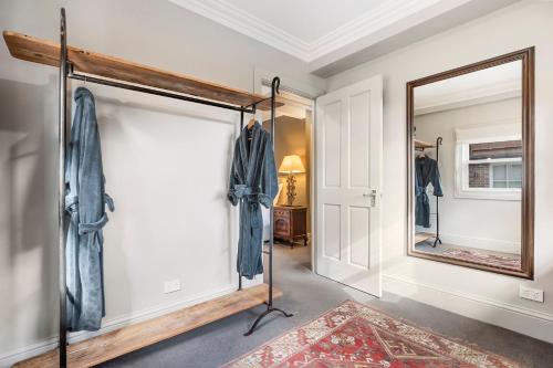a dressing room with a mirror and a closet at The Rivulet in Hobart