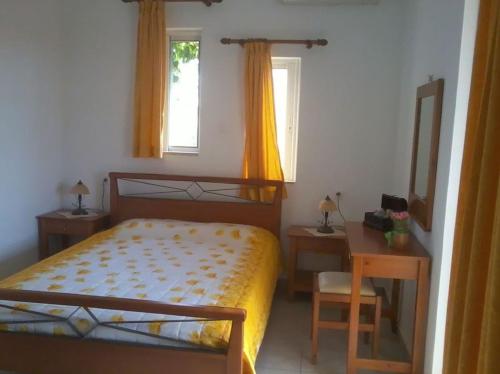 Кровать или кровати в номере Kioni Villas