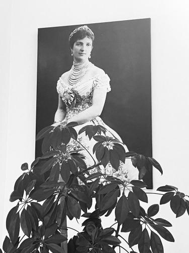 a black and white photo of a woman in a dress at Hotel Regina Margherita in Bordighera