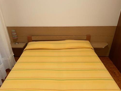 Ένα ή περισσότερα κρεβάτια σε δωμάτιο στο Condominio Sabrina
