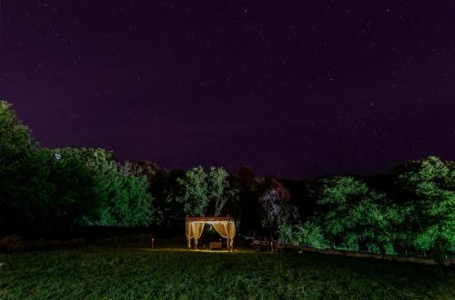a night view of a tent in a field at Studio Acropolis Serres With Parking Next to Center in Serres