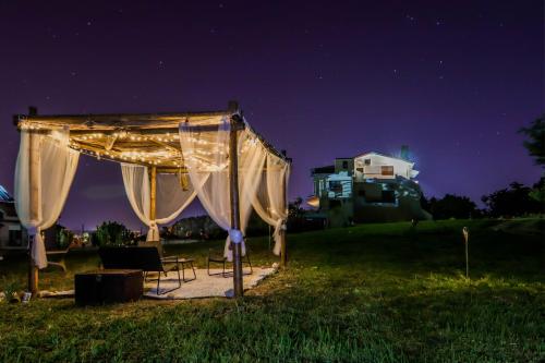 a tent in a field at night at Studio Acropolis Serres With Parking Next to Center in Serres
