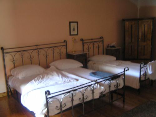 Postelja oz. postelje v sobi nastanitve Guesthouse Domacija Sajna
