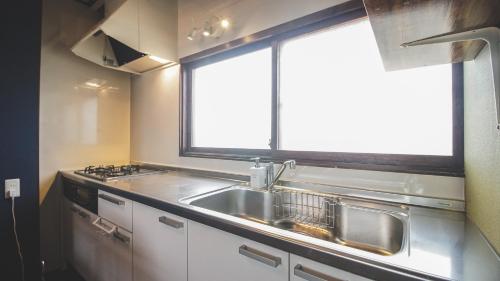 Kuchyň nebo kuchyňský kout v ubytování Furano View House