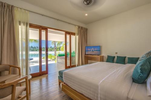Postel nebo postele na pokoji v ubytování Rahaa Resort Maldives