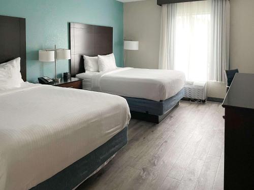 
Łóżko lub łóżka w pokoju w obiekcie Comfort Inn & Suites Melbourne-Viera
