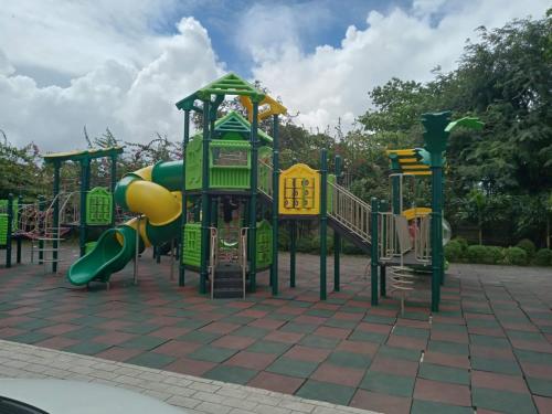 a group of playground equipment in a park at HPH Staycation - Saekyung 956 Condo in Mactan