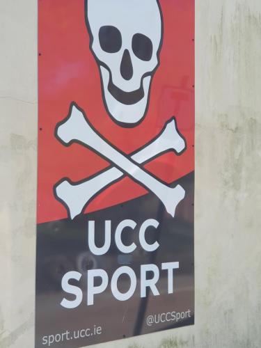 a sign on a wall with a skull and crossbones at River View Apartment Suite in Cork