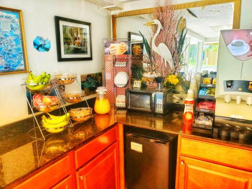 a kitchen with a counter top with fruit on it at The Port Hotel and Marina in Crystal River