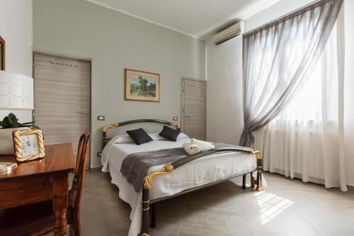 Villetta Belvedere tesisinde bir odada yatak veya yataklar