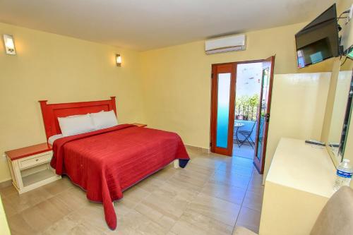 Postel nebo postele na pokoji v ubytování Hotel Santa Rita