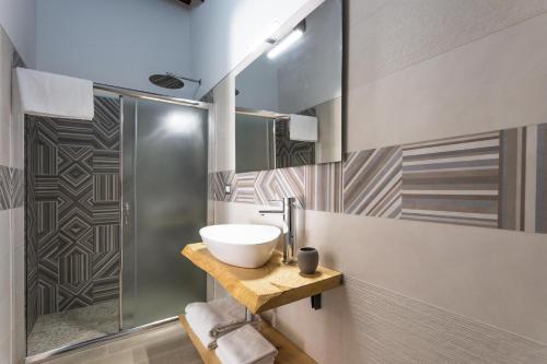 a bathroom with a sink and a shower at B&B Villa Massimo in Porto Cesareo