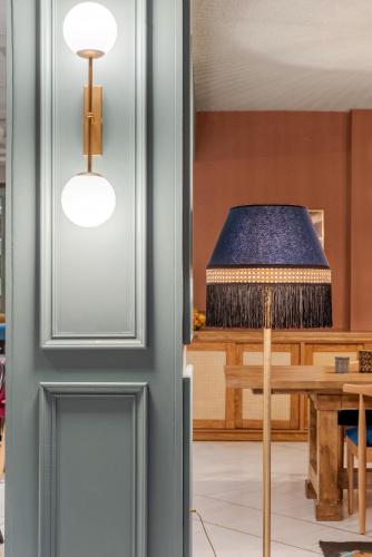 a door leading into a living room with a bed at Paeonia Arachova in Arachova