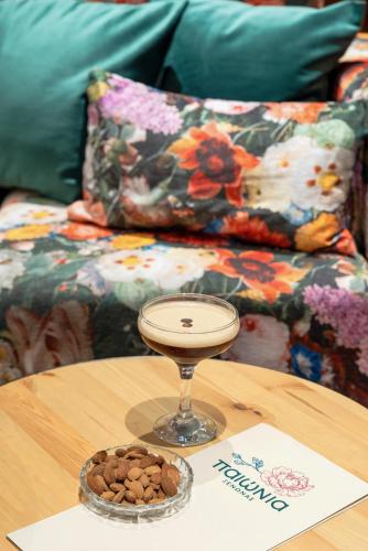 a coffee table with a bowl of dog food on it at Paeonia Arachova in Arachova