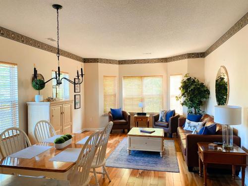 a living room with a couch and a table at Two-Bedroom Vacation Condo in Myrtle Beach