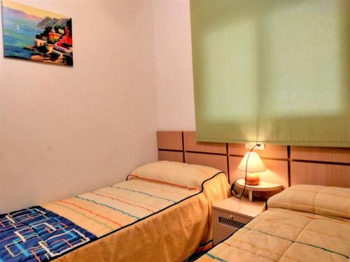 Postel nebo postele na pokoji v ubytování ACV - Valparaiso - 2ª linea, planta 3, norte