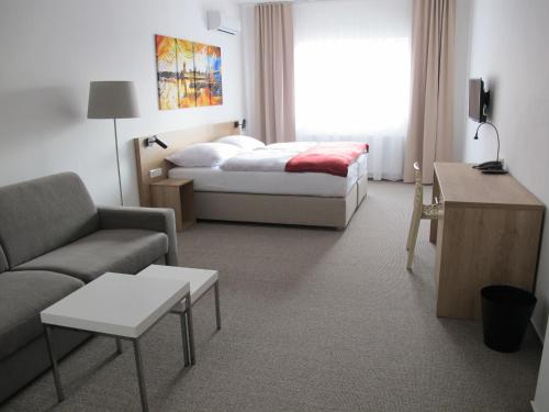 Voodi või voodid majutusasutuse Hotel Kapitol toas